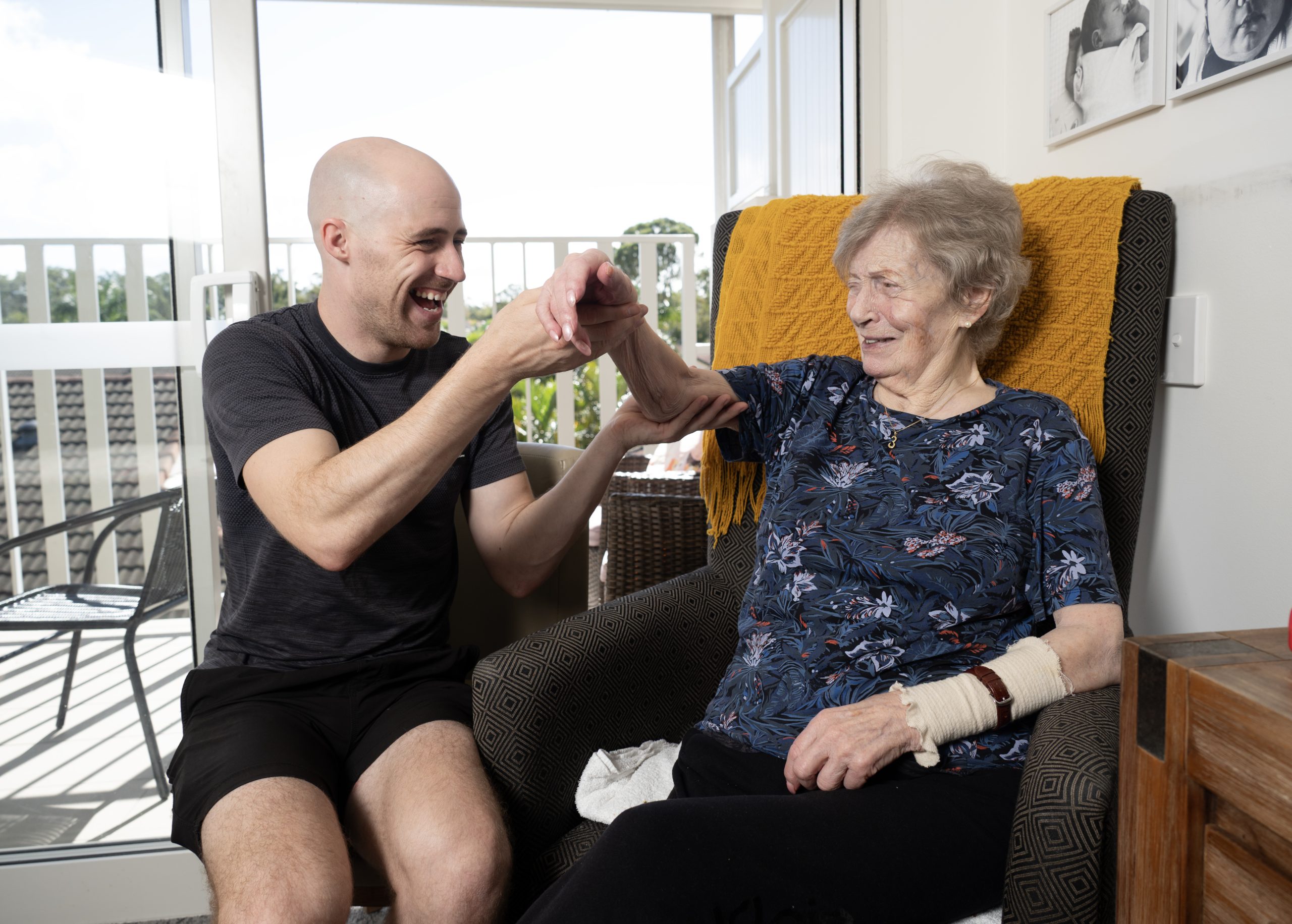 GM Physiotherapy physiotherapist working with an older client at home in Carrara